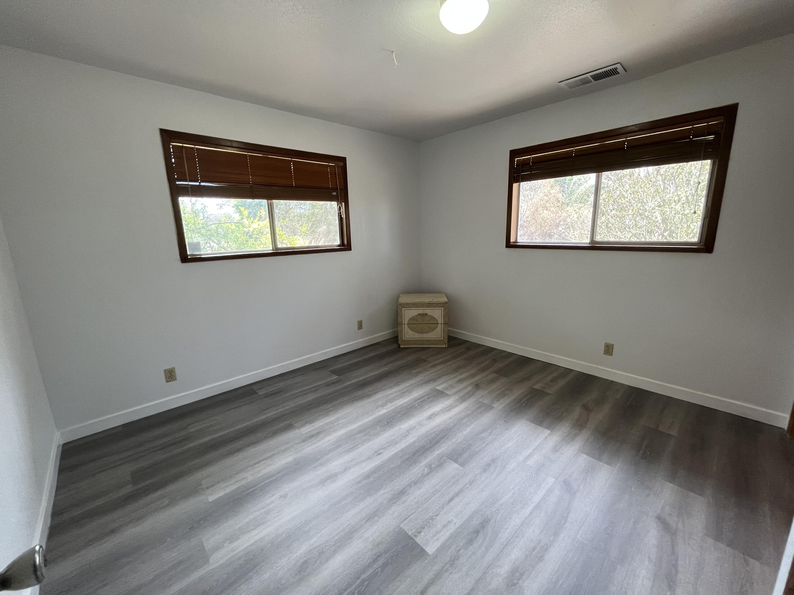 2713 Woodson Avenue Corning, CA 96021 - Photo 13 of 38 a view of a hallway with wooden floor and a window