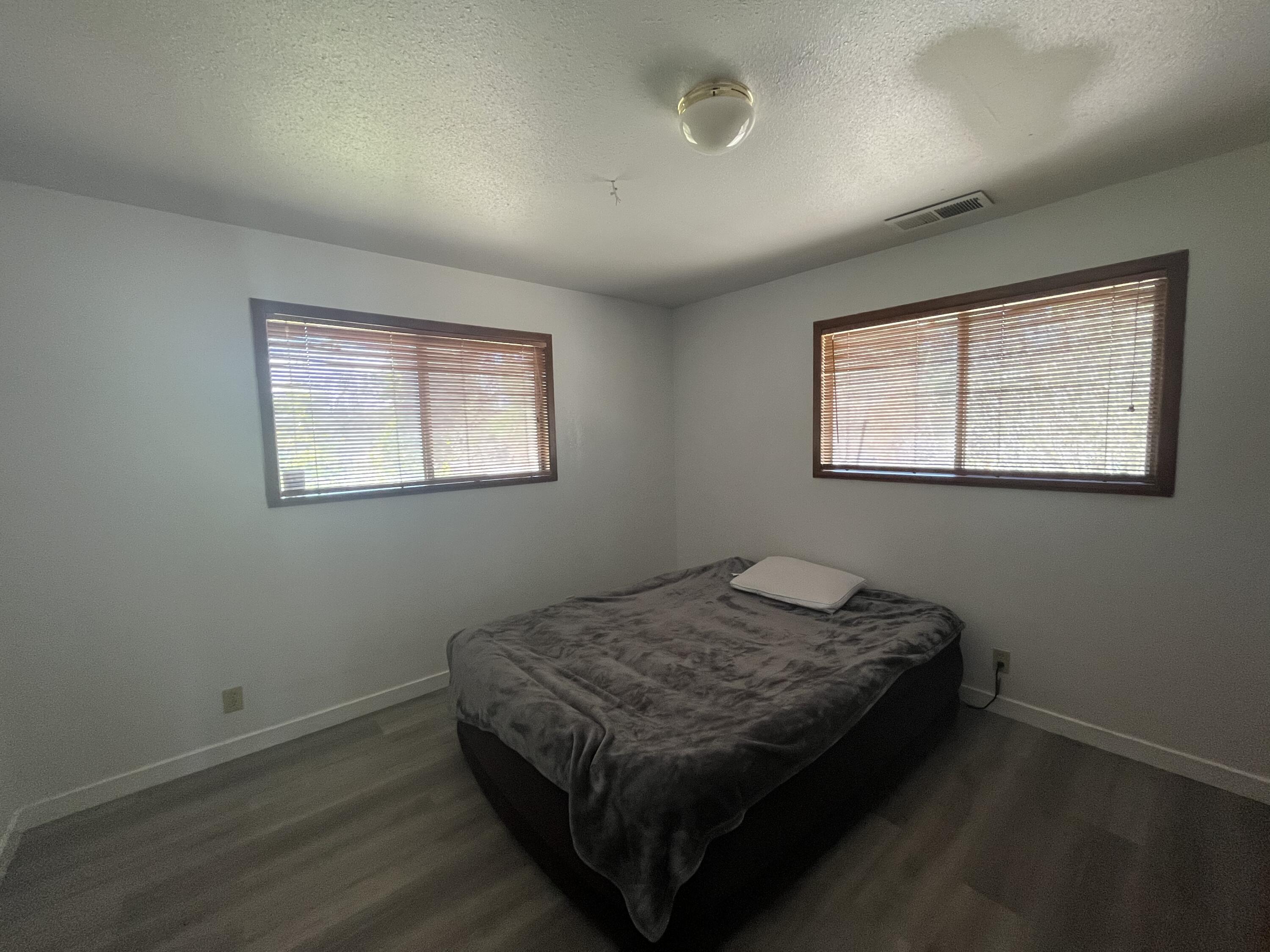 2713 Woodson Avenue Corning, CA 96021 - Photo 15 of 38 a bed sitting in a bedroom next to a window