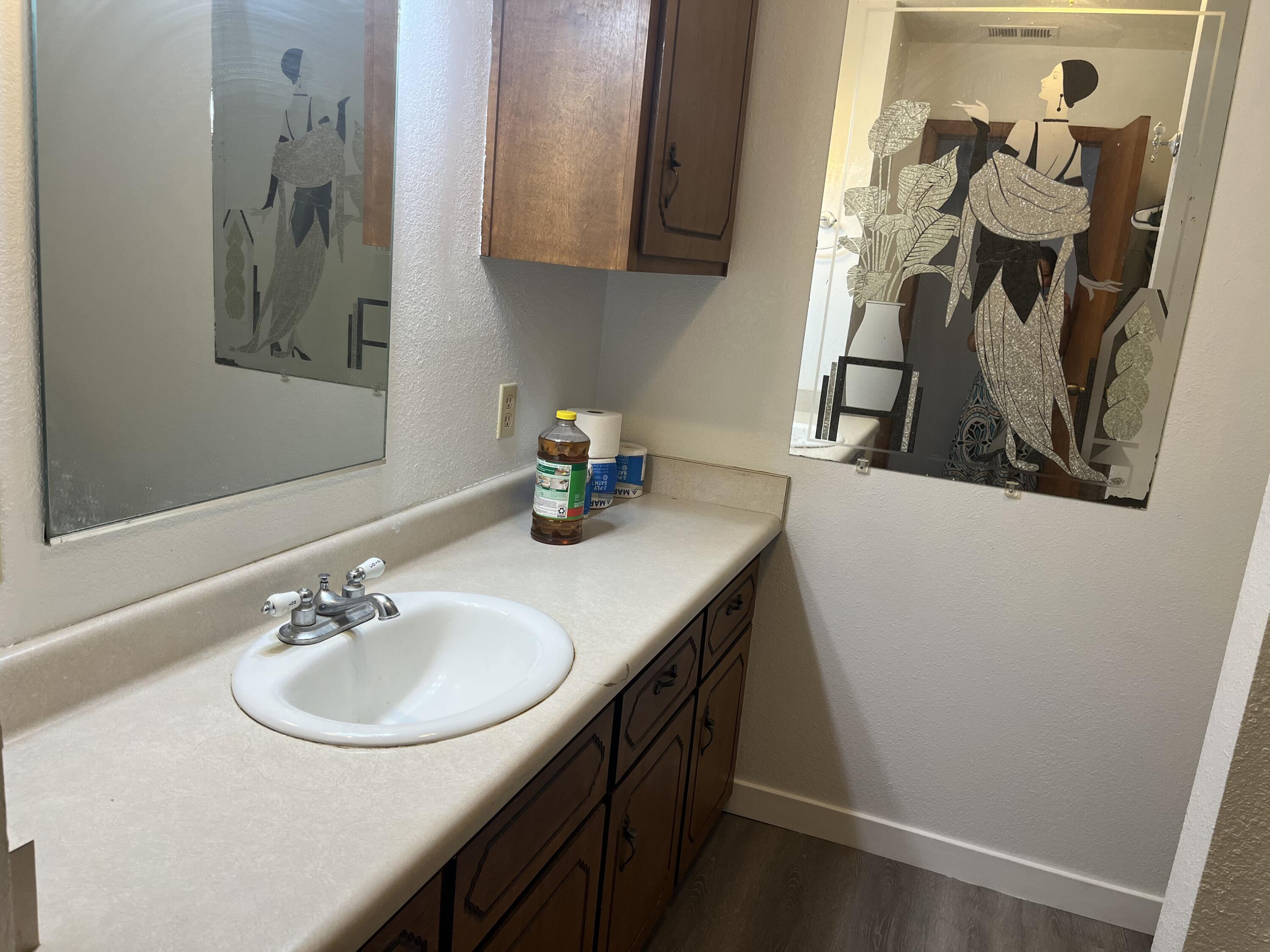 2713 Woodson Avenue Corning, CA 96021 - Photo 18 of 38 a bathroom with a sink and a mirror