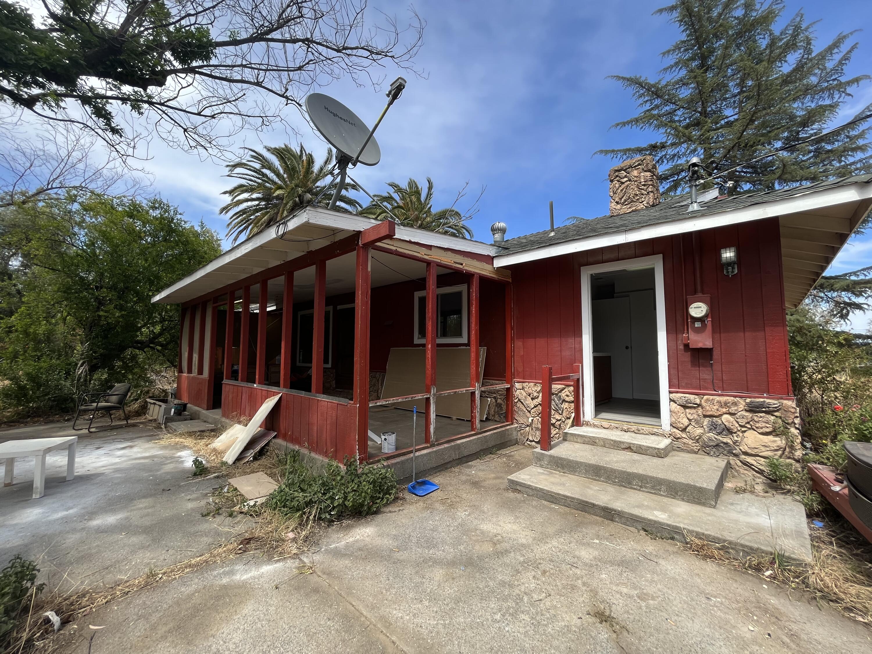 2713 Woodson Avenue Corning, CA 96021 - Photo 20 of 38 a view of a house with a yard and patio