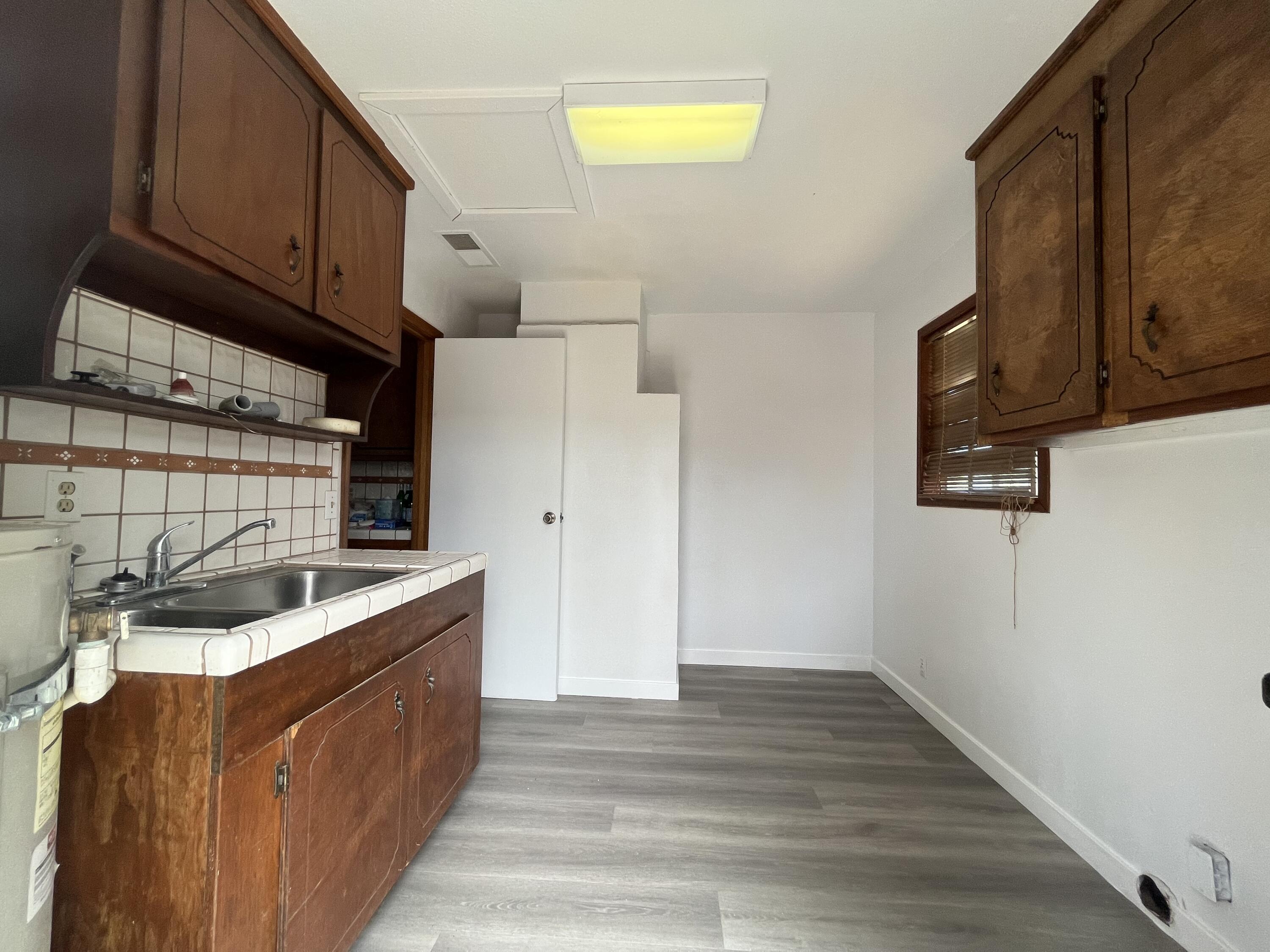 2713 Woodson Avenue Corning, CA 96021 - Photo 21 of 38 a kitchen with stainless steel appliances granite countertop a sink stove and cabinets