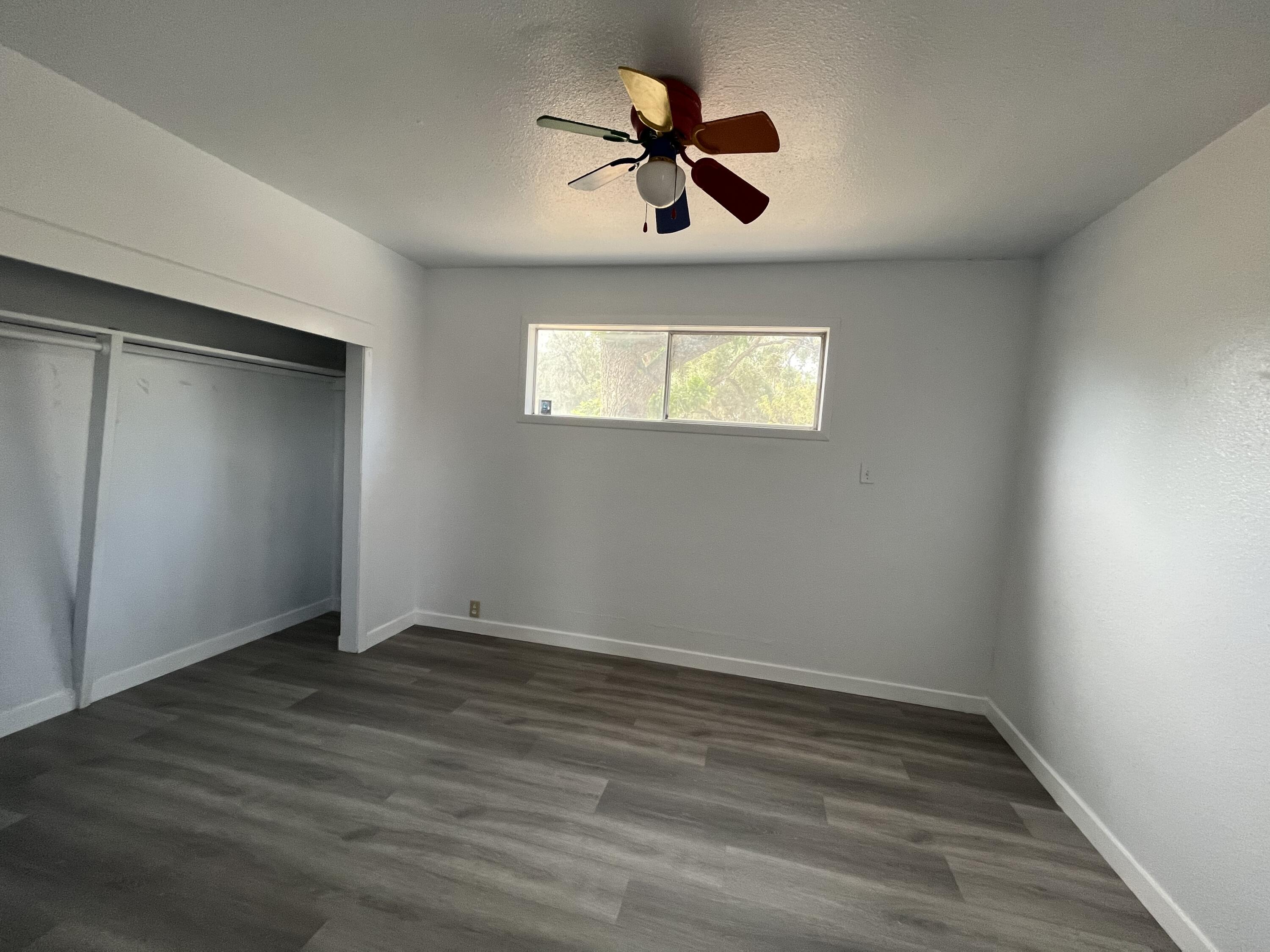 2713 Woodson Avenue Corning, CA 96021 - Photo 26 of 38 wooden floor in an empty room with a window