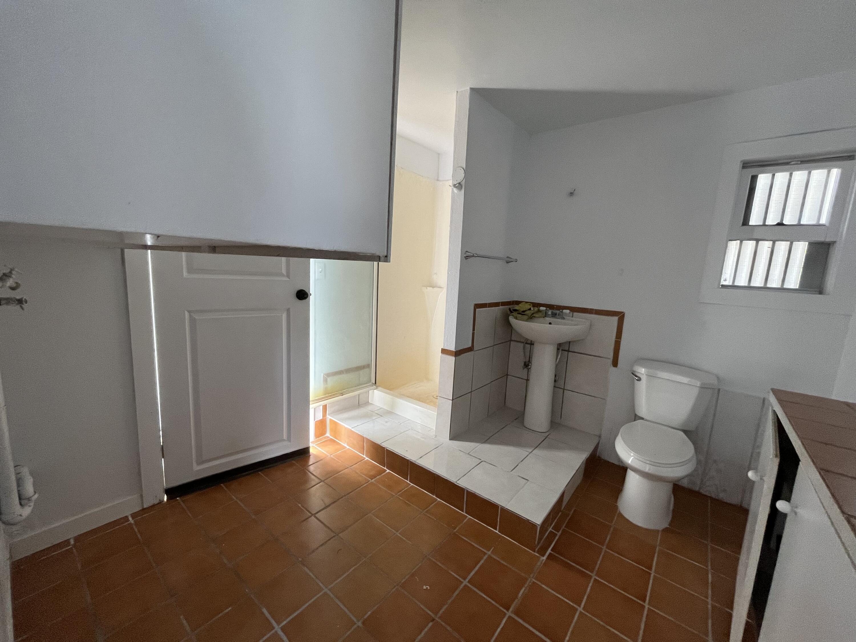 2713 Woodson Avenue Corning, CA 96021 - Photo 27 of 38 a bathroom with a toilet and a sink