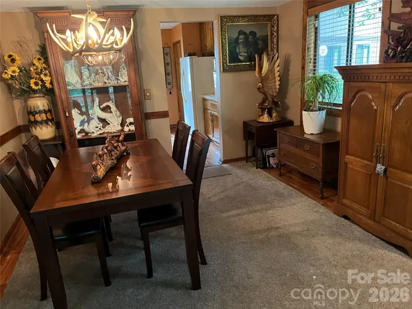 a view of a dining room with furniture window and outside view