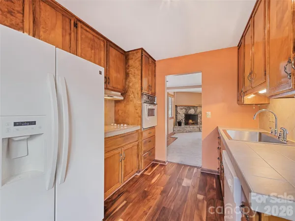 a kitchen with stainless steel appliances a refrigerator and a stove