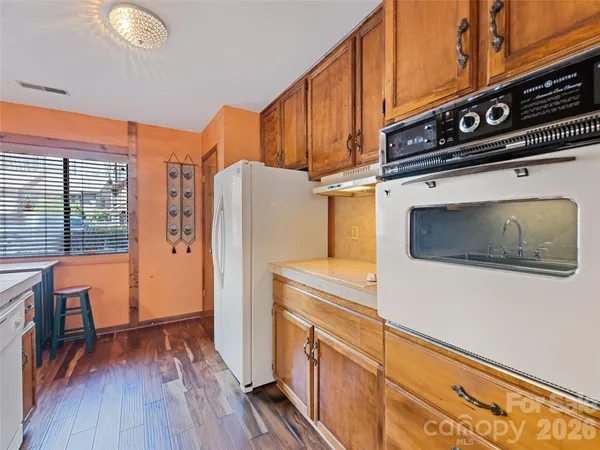 a kitchen with stainless steel appliances a stove and a refrigerator