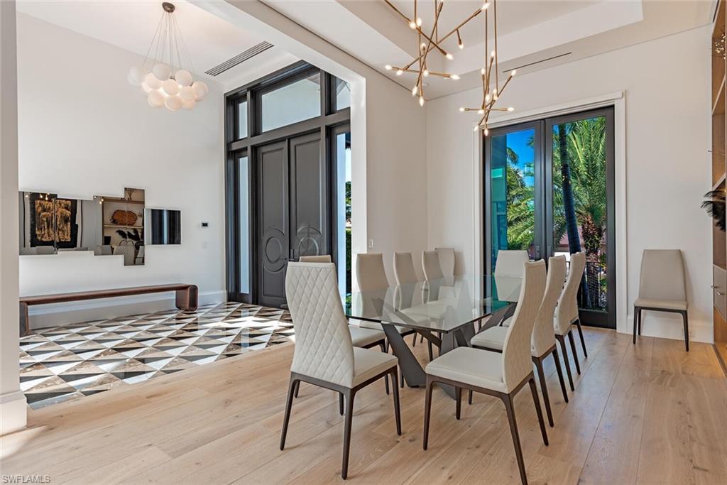 608 16th Avenue South Naples, FL 34102 - Photo 11 of 36 a view of a dining room with furniture window and wooden floor