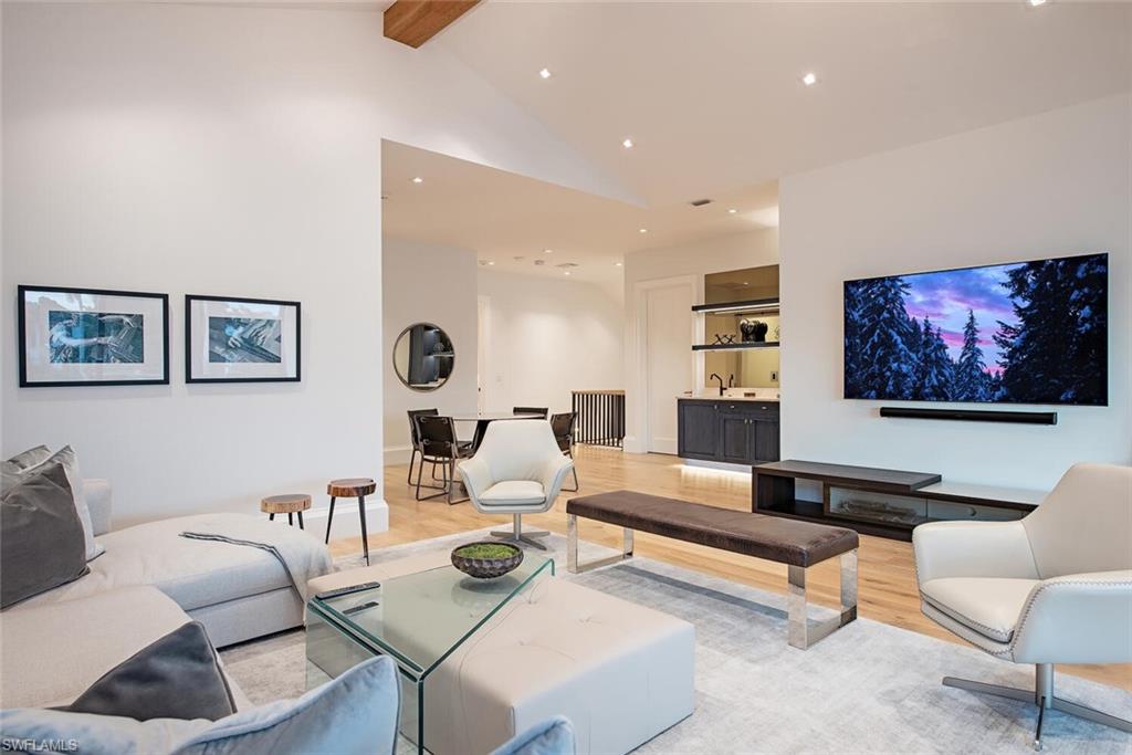 608 16th Avenue South Naples, FL 34102 - Photo 15 of 36 a living room with furniture and a flat screen tv