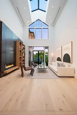 a view of a livingroom with furniture and floor to ceiling window
