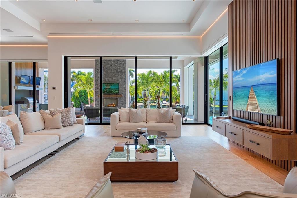 608 16th Avenue South Naples, FL 34102 - Photo 4 of 36 a living room with furniture and a large window