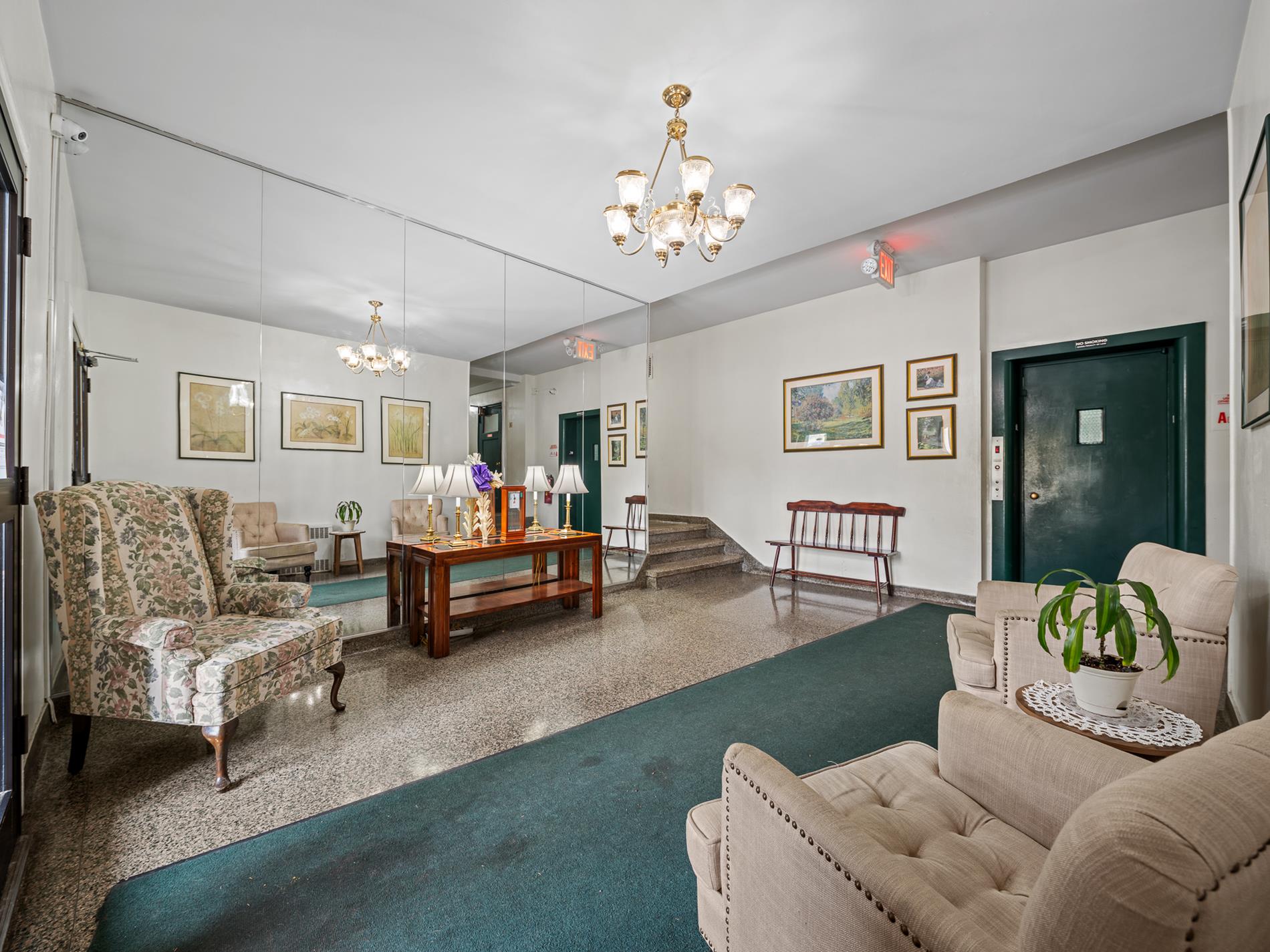 6665 Colonial Road, Unit 5D Brooklyn, NY 11220 - Photo 2 of 18 a living room with furniture and a chandelier