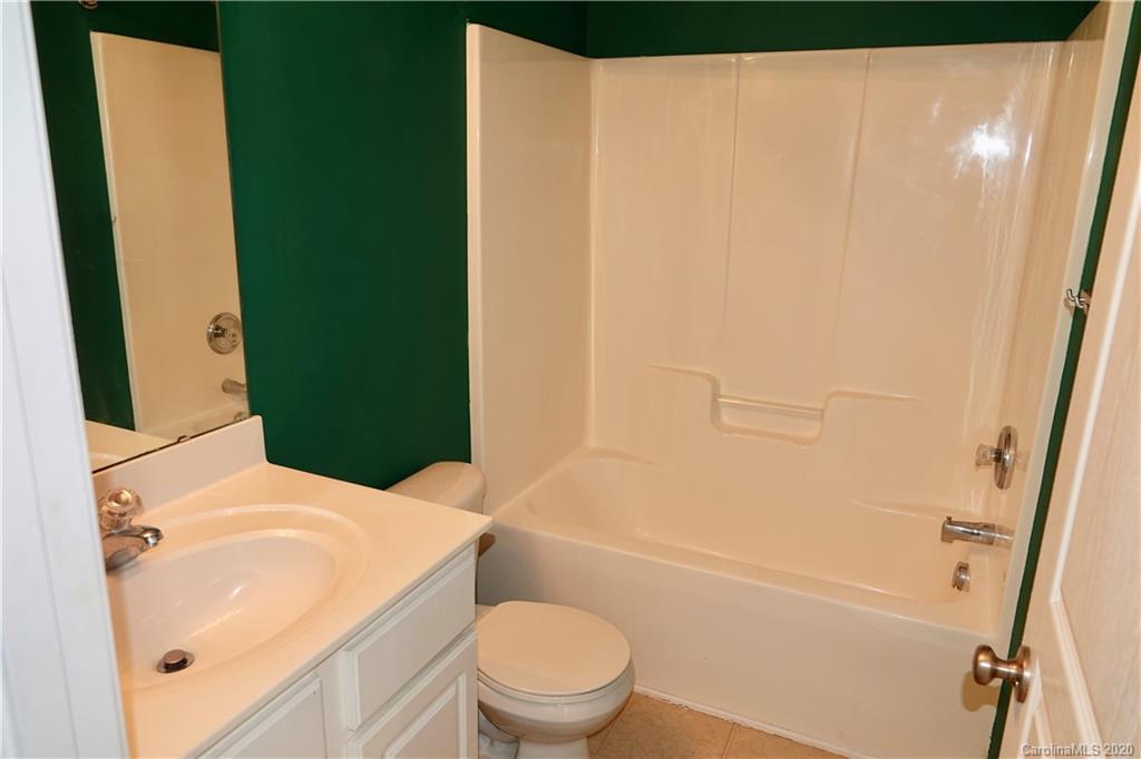 974 Copperstone Lane Fort Mill, SC 29708 - Photo 14 of 22 a bathroom with a sink a toilet and shower