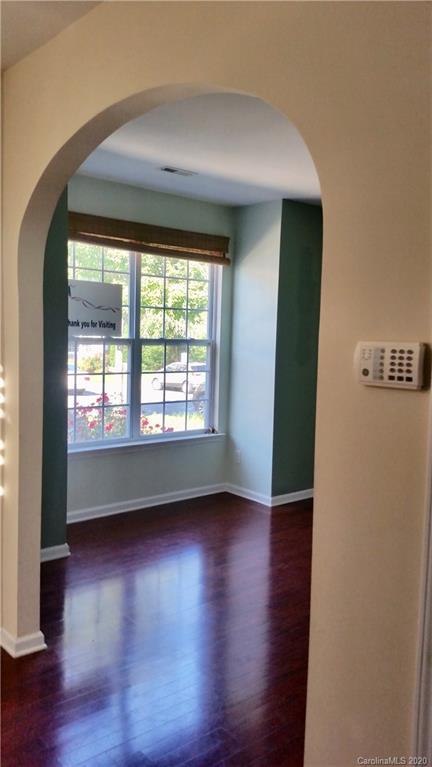 974 Copperstone Lane Fort Mill, SC 29708 - Photo 3 of 22 an empty room with wooden floor and windows