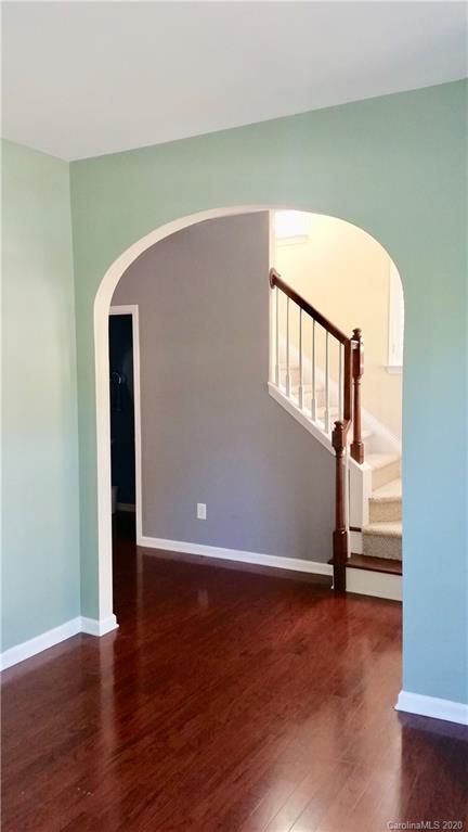 974 Copperstone Lane Fort Mill, SC 29708 - Photo 4 of 22 a view of a livingroom with wooden floor and a staircase