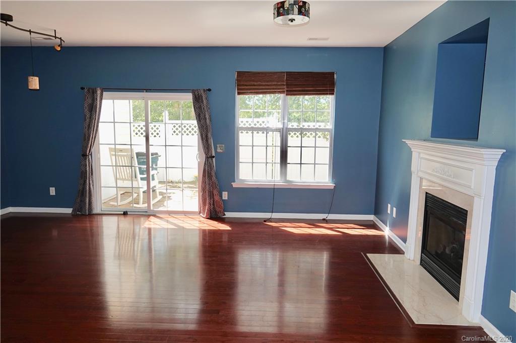 974 Copperstone Lane Fort Mill, SC 29708 - Photo 5 of 22 a view of an empty room with window and wooden floor