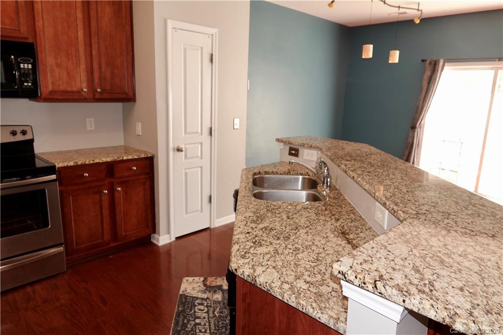 974 Copperstone Lane Fort Mill, SC 29708 - Photo 8 of 22 a living room with stainless steel appliances granite countertop furniture and a wooden floor