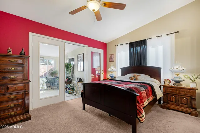 a kitchen with stainless steel appliances granite countertop a refrigerator a stove and a sink with wooden floor