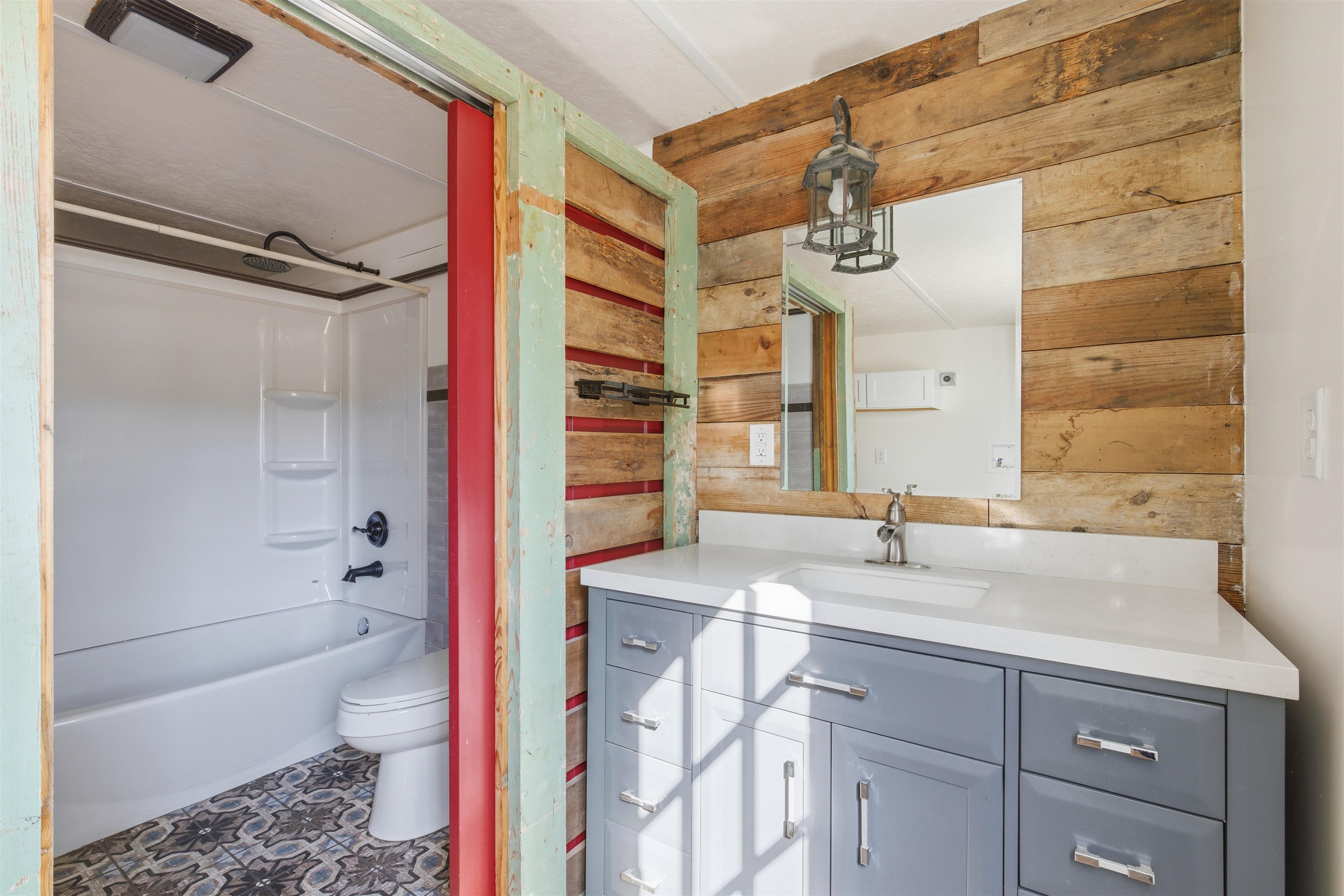 418 Polvado Round Mountain, TX 78663 - Photo 14 of 26 a bathroom with a sink and a bathtub