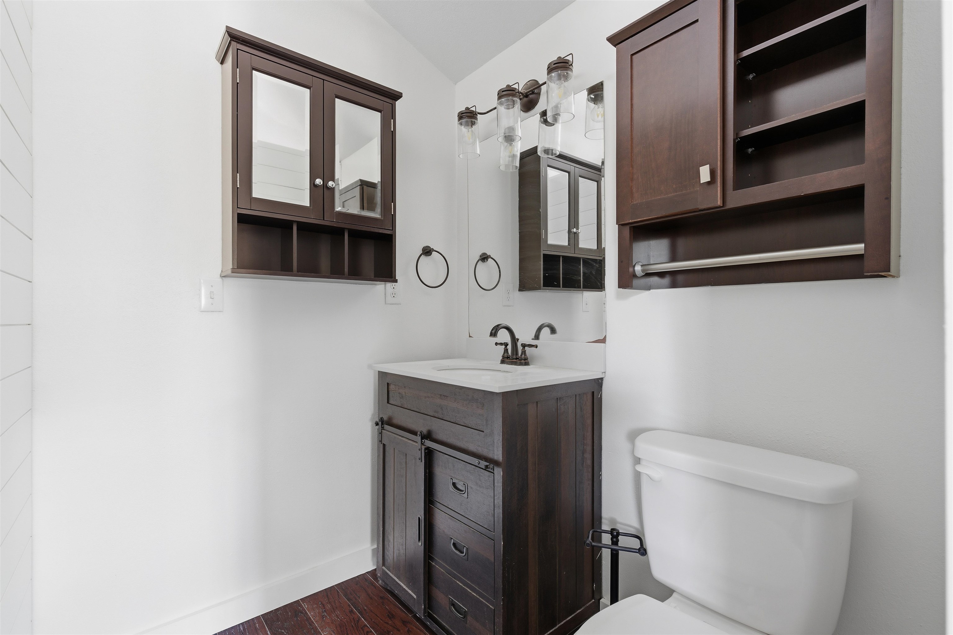 418 Polvado Round Mountain, TX 78663 - Photo 16 of 26 a bathroom with a toilet sink and mirror