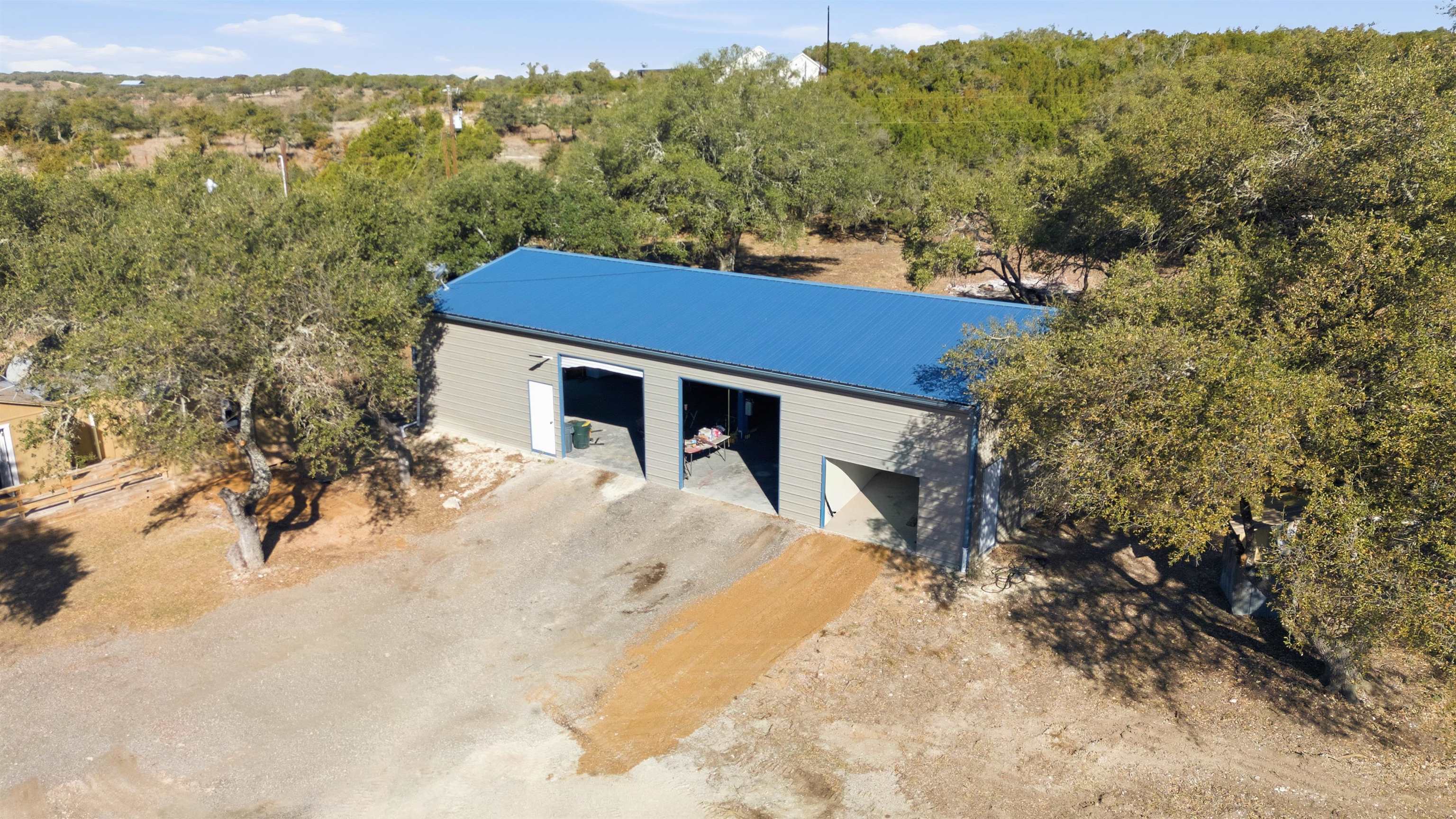 418 Polvado Round Mountain, TX 78663 - Photo 25 of 26 a view of a house with a yard