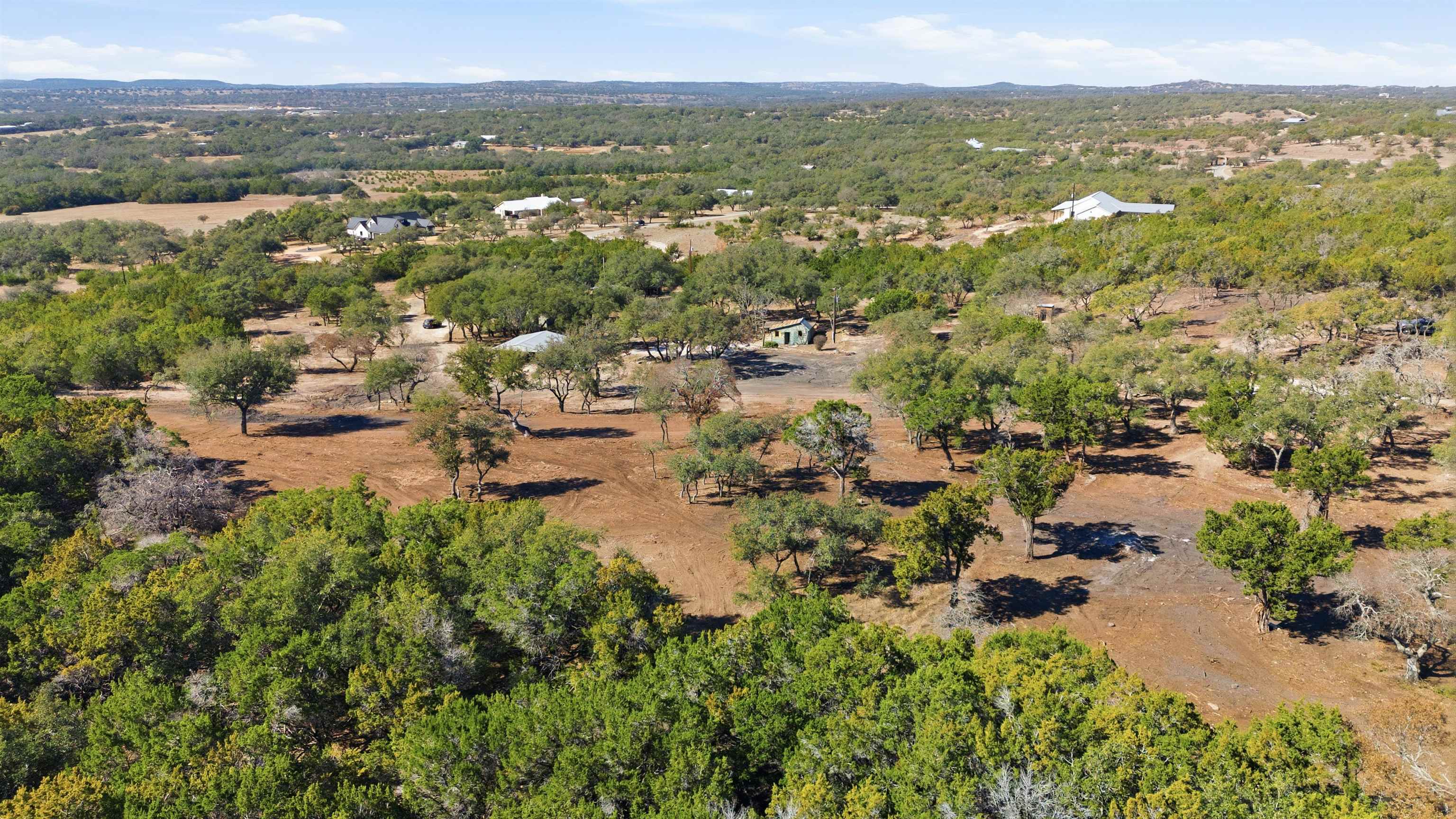 418 Polvado Round Mountain, TX 78663 - Photo 26 of 26 an aerial view of residential house with outdoor space and trees