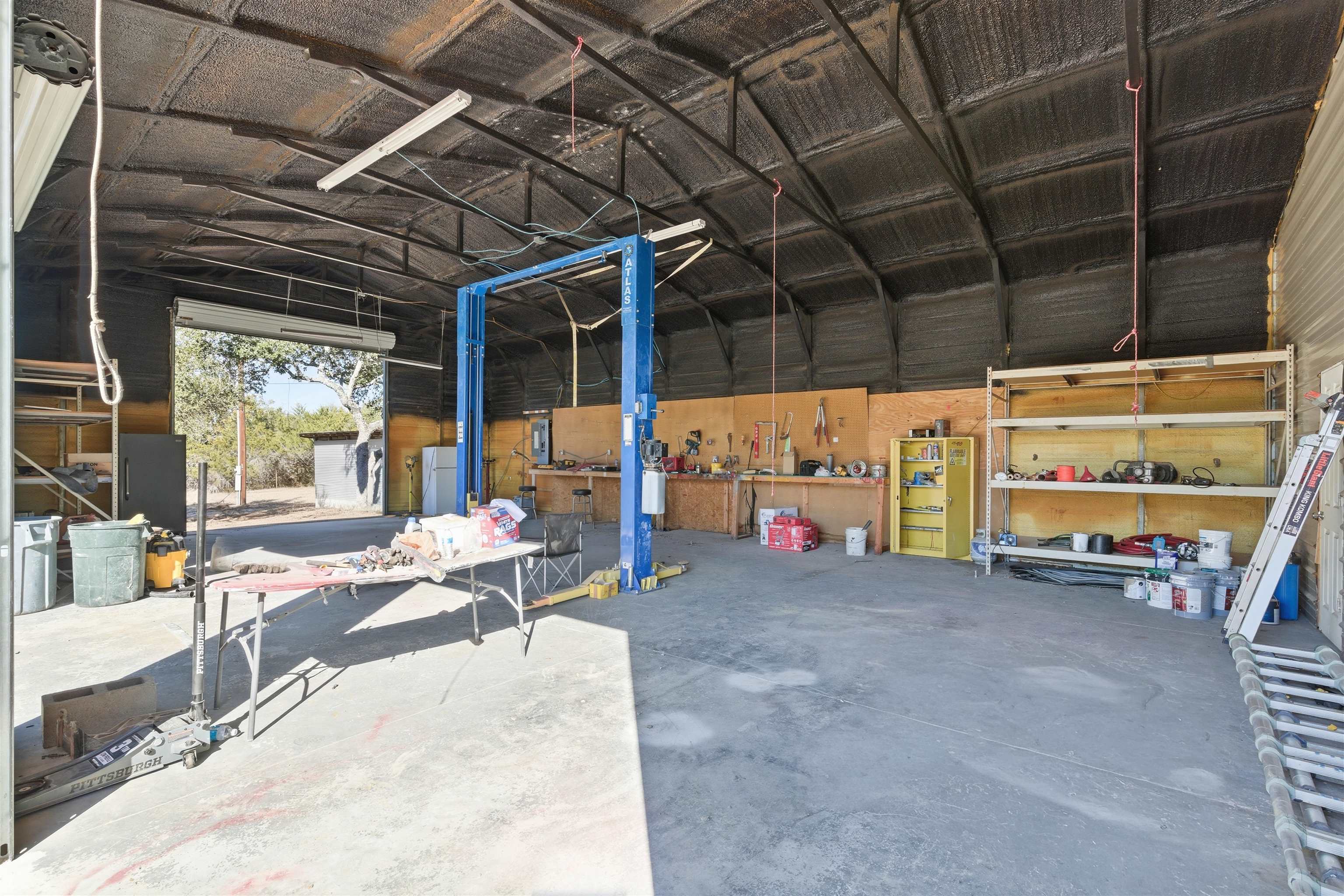 418 Polvado Round Mountain, TX 78663 - Photo 7 of 26 a view of a room with gym equipment