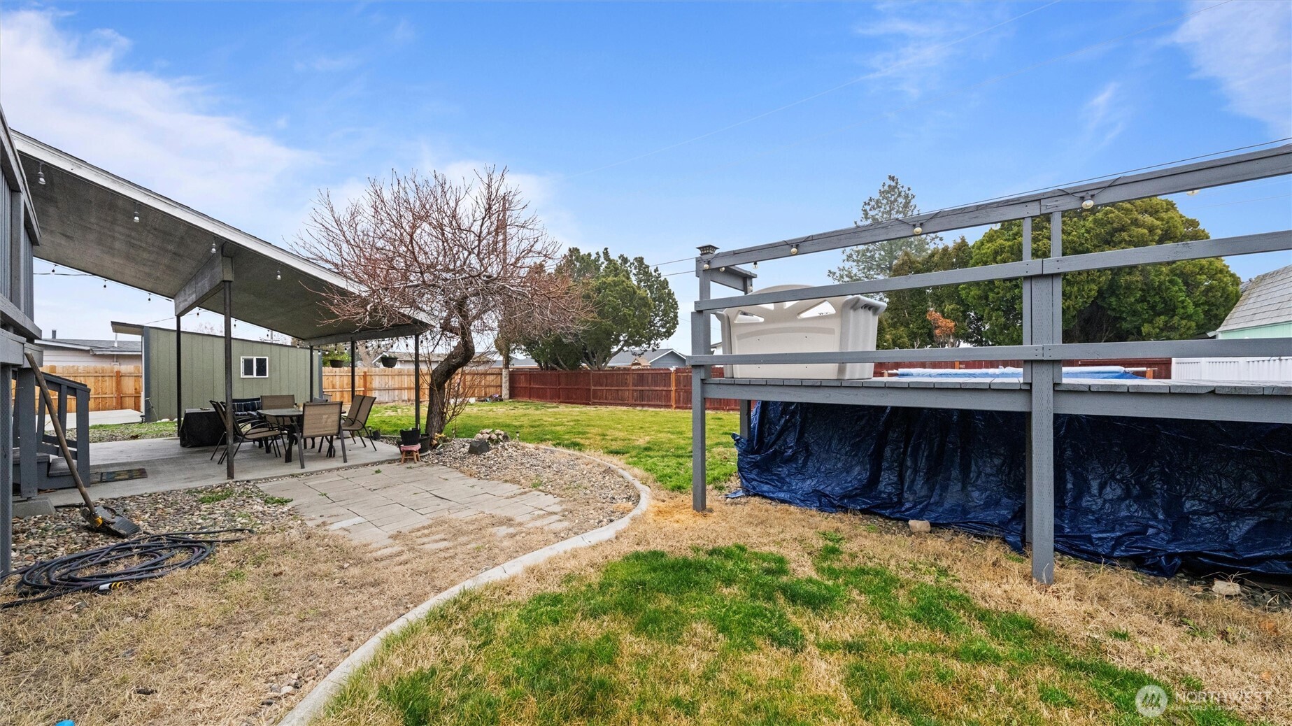 321 South Sheppard Street Kennewick, WA 99336 - Photo 22 of 22 a view of a house with a small yard and wooden fence