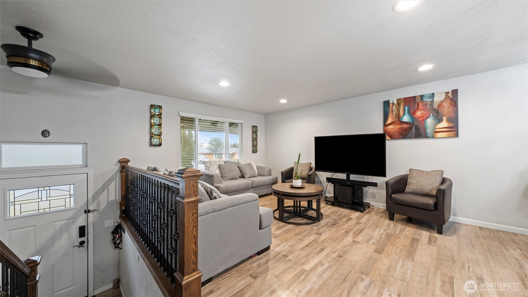 321 South Sheppard Street Kennewick, WA 99336 - Photo 3 of 22 a living room with furniture and a flat screen tv