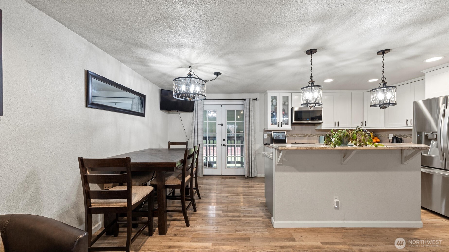 321 South Sheppard Street Kennewick, WA 99336 - Photo 5 of 22 a view of a dining room with furniture and wooden floor