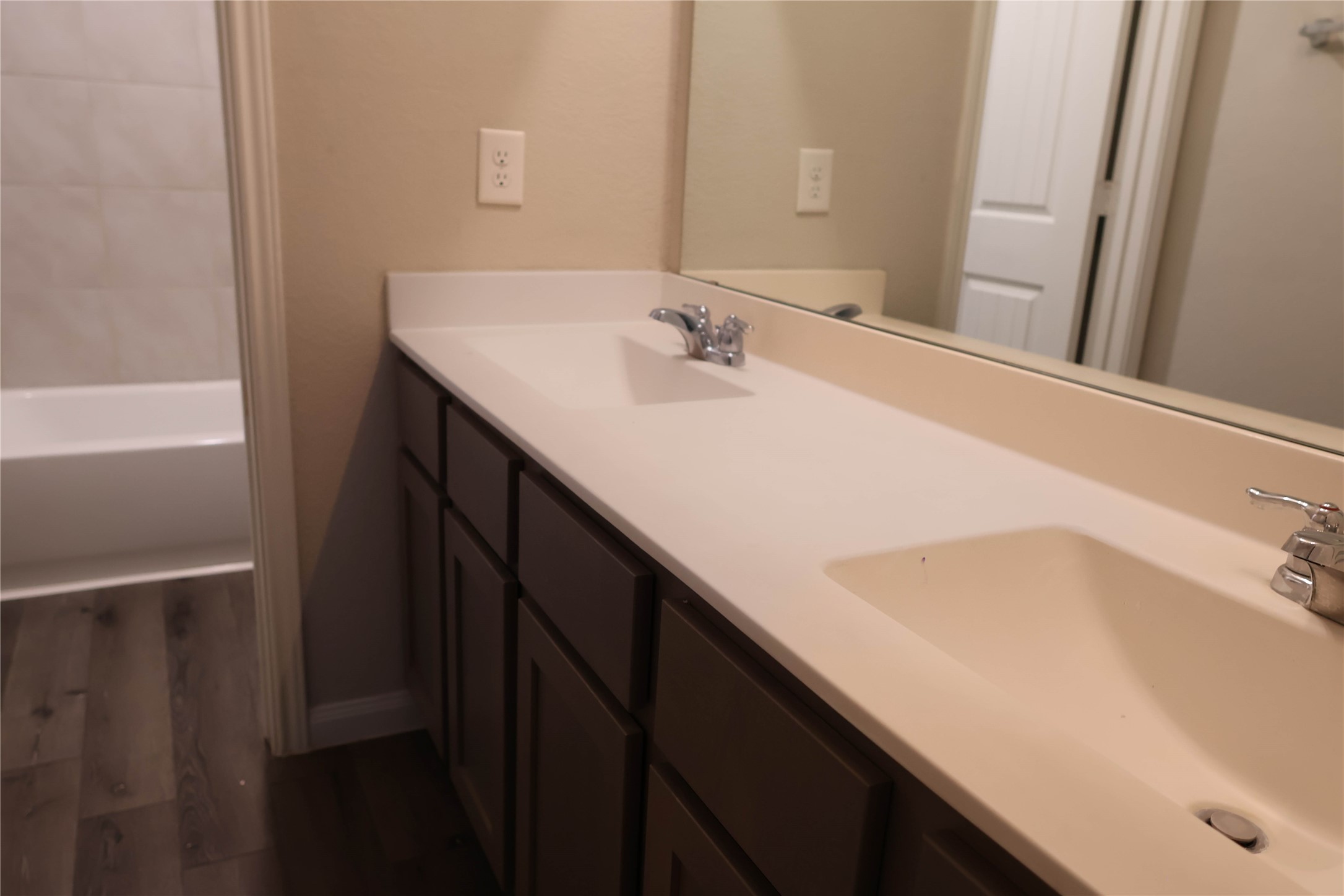 2522 Sturgeon Way Conroe, TX 77384 - Photo 17 of 19 a bathroom with a sink and a large mirror