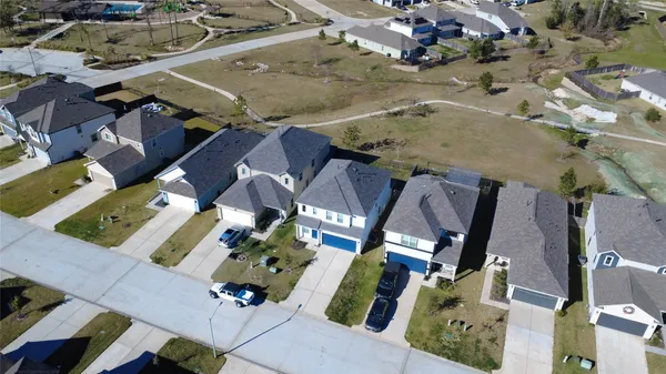 an aerial view of houses with outdoor space