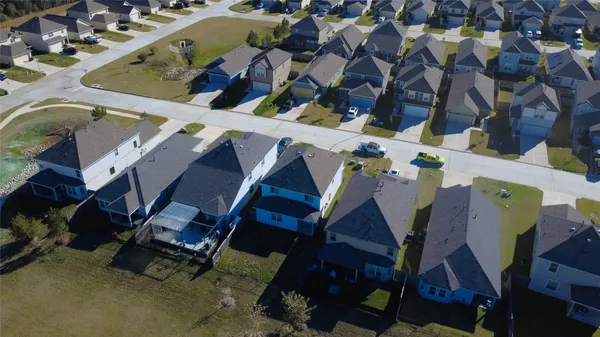 an aerial view of houses with wooden stairs