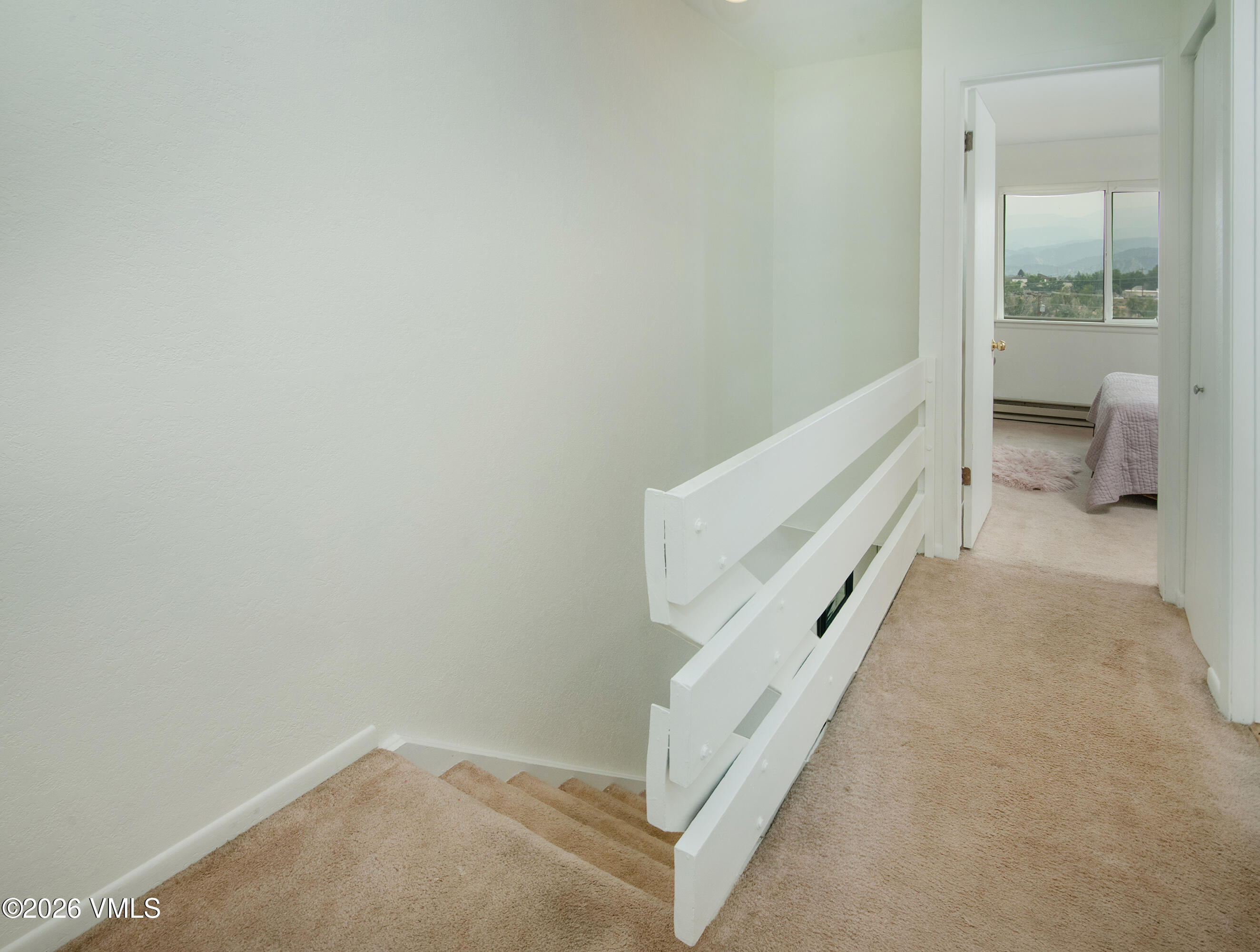 85 Chambers Avenue, Unit 10 Eagle, CO 81631 - Photo 12 of 41 a view of a hallway with white walls and stairs
