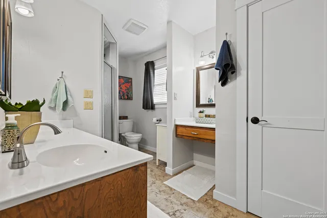 a bathroom with a sink and mirror