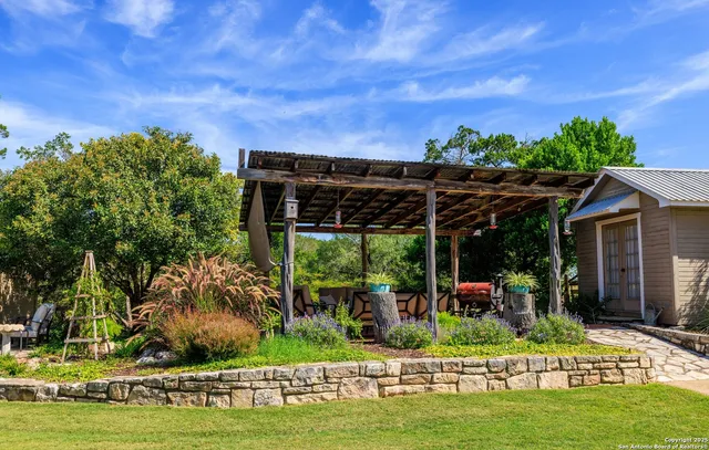 a view of a porch with a table and chairs
