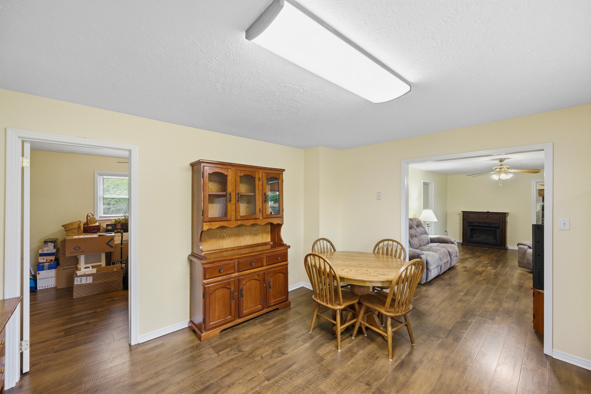 944 Brooksie Thompson Road Decaturville, TN 38329 - Photo 22 of 47 a view of a dining room with furniture and wooden floor