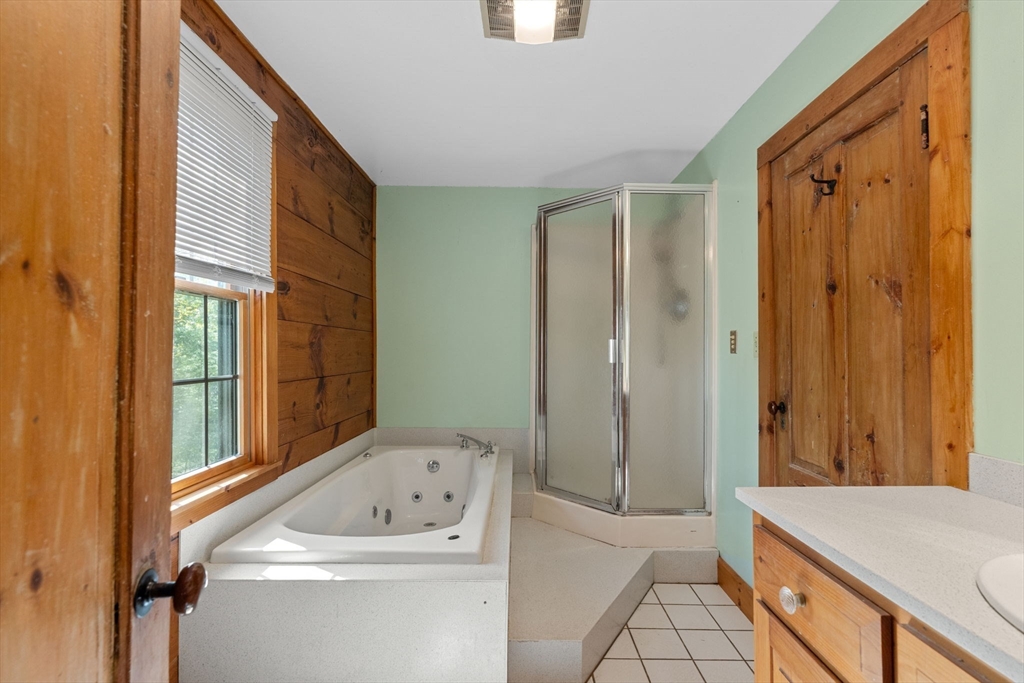 362 Snows Pond Road Rochester, MA 02770 - Photo 17 of 41 a bathroom with a sink a toilet and a shower