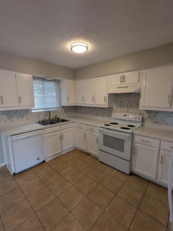 514 East Belt Line Road, Unit B13 DeSoto, TX 75115 - Photo 11 of 28 a kitchen with a stove sink and cabinets