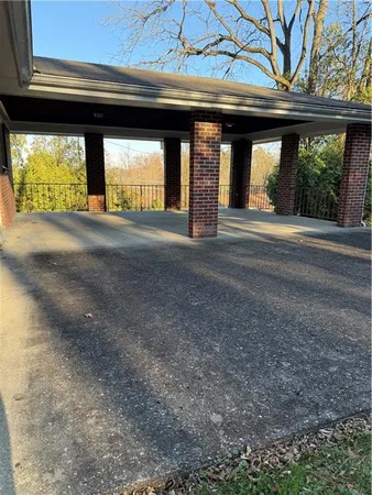 a backyard of a house with lots of green space and plants