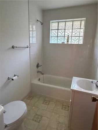 a view of empty room with fireplace