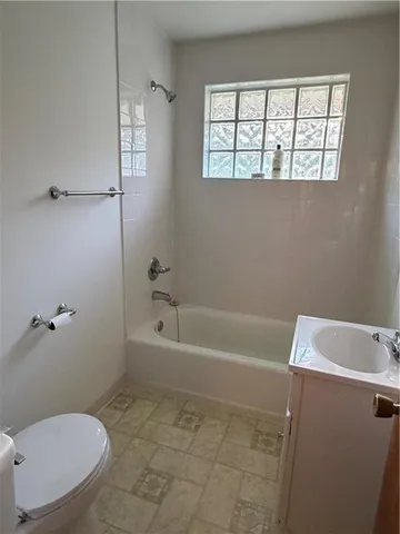 a view of empty room with fireplace