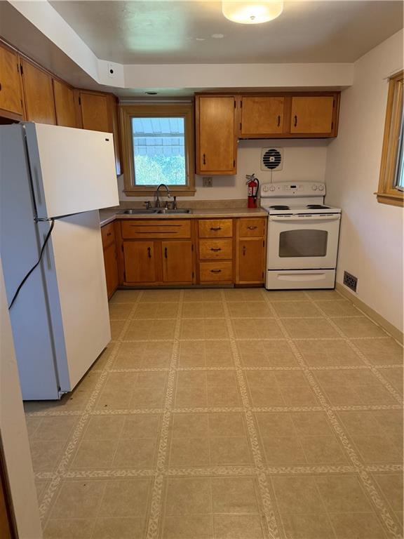 123 B Hidden Valley Road Canonsburg, PA 15317 - Photo 6 of 20 a kitchen with a cabinets a stove a sink and a refrigerator