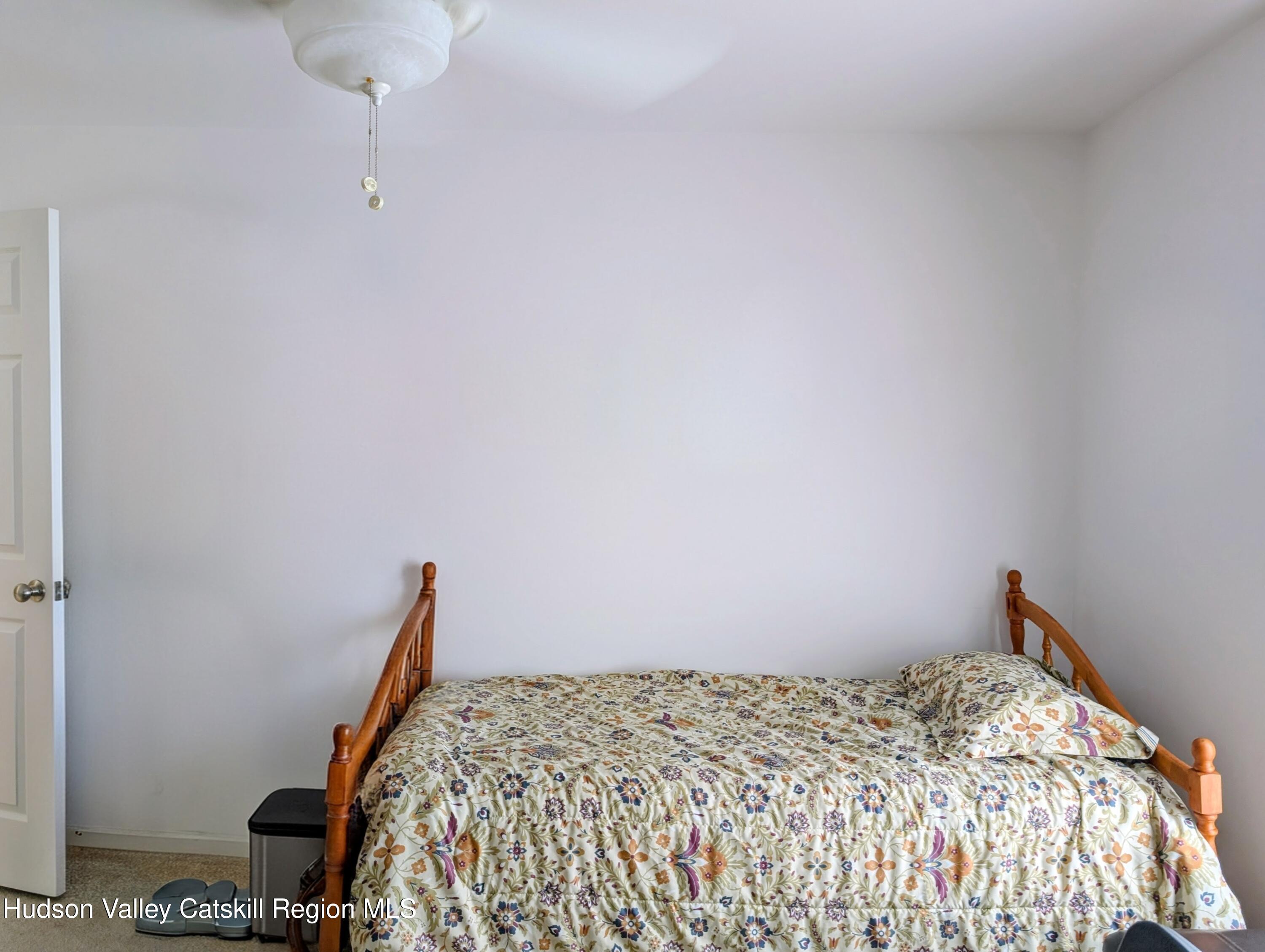 834 Co Rte 19 Elizaville, NY 12523 - Photo 13 of 32 a bed sitting in a bedroom next to a window