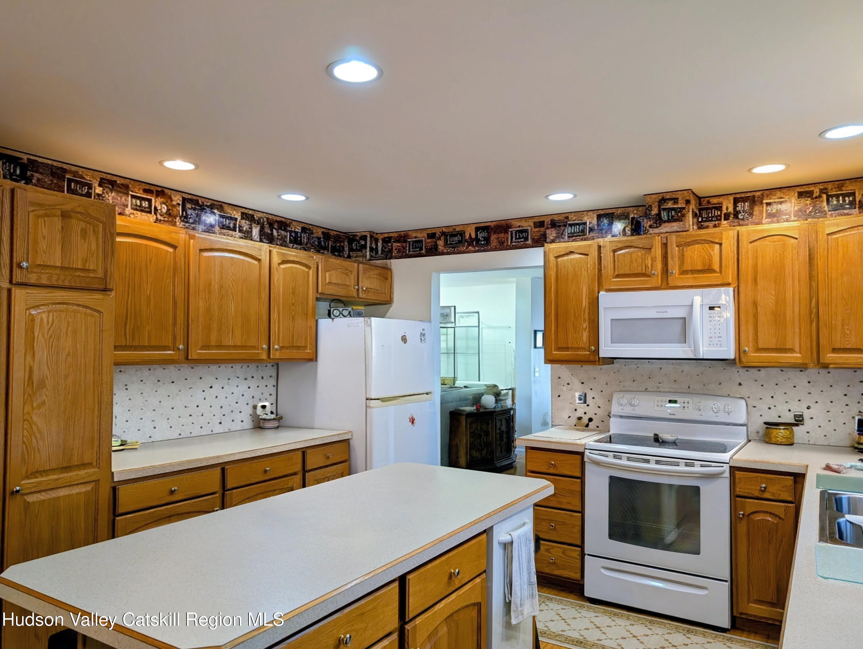 834 Co Rte 19 Elizaville, NY 12523 - Photo 2 of 32 a kitchen with a stove a sink and a refrigerator