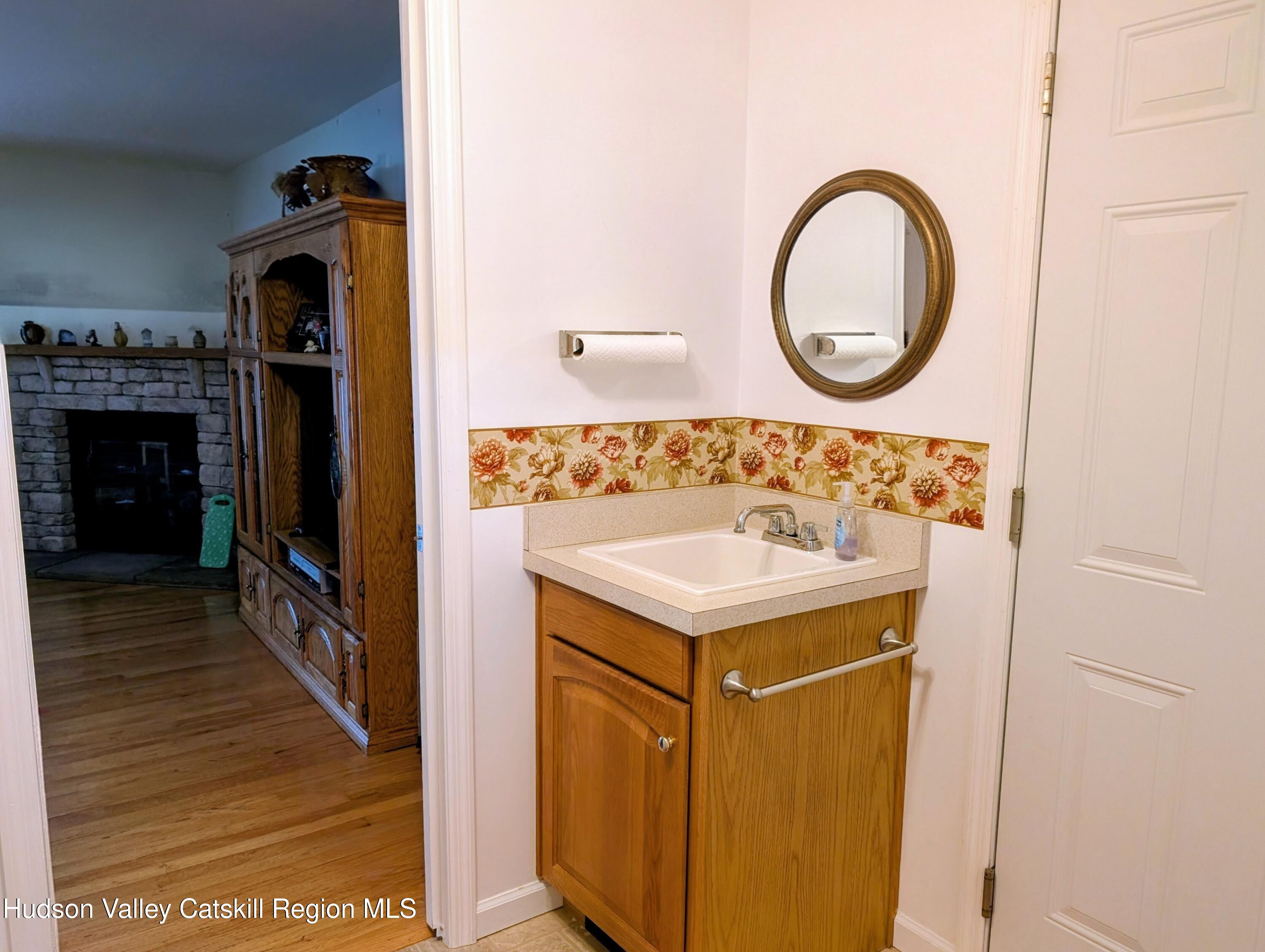 834 Co Rte 19 Elizaville, NY 12523 - Photo 24 of 32 a utility room with a sink a mirror and a washer