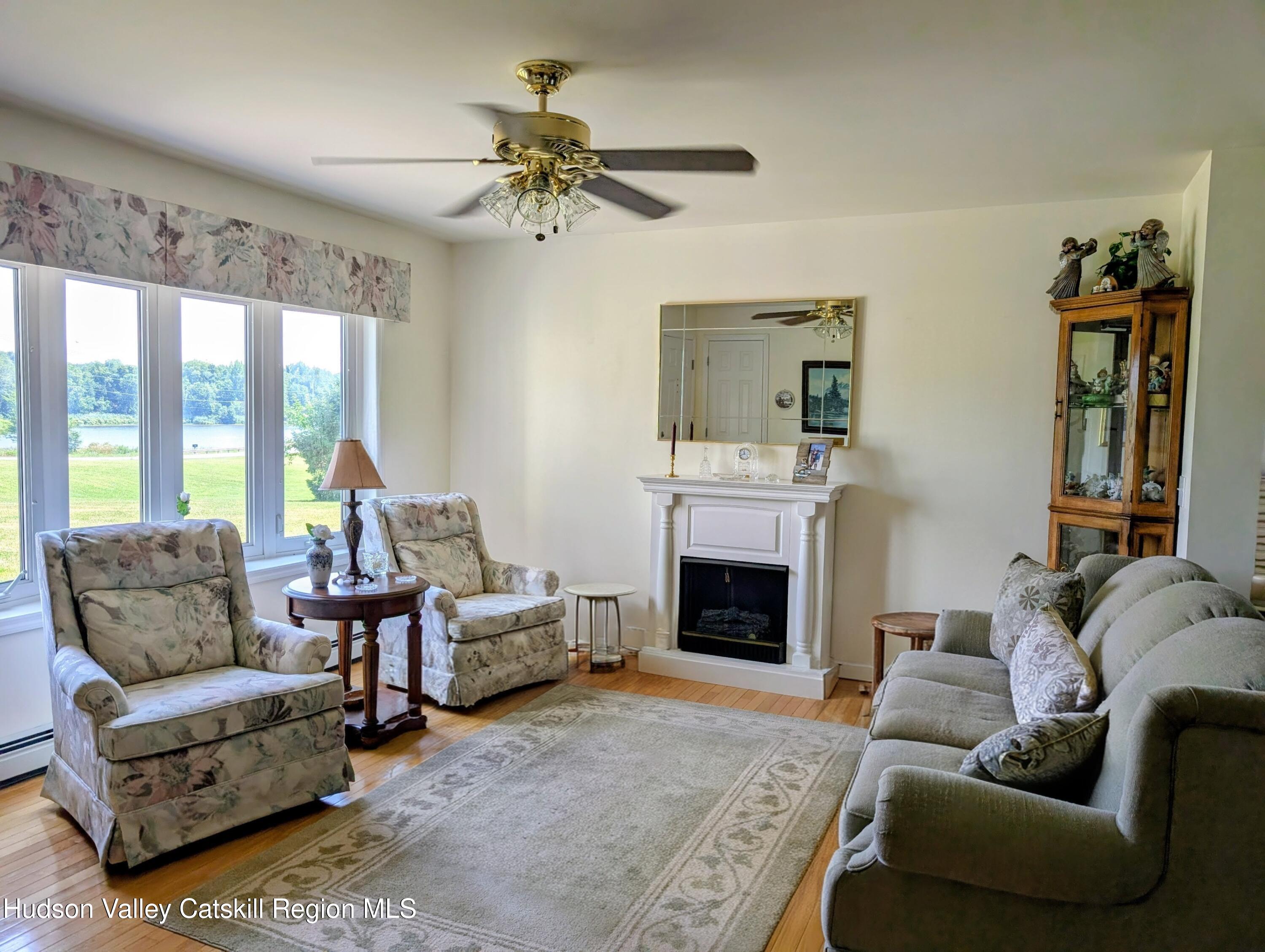 834 Co Rte 19 Elizaville, NY 12523 - Photo 5 of 32 a living room with furniture and a fireplace