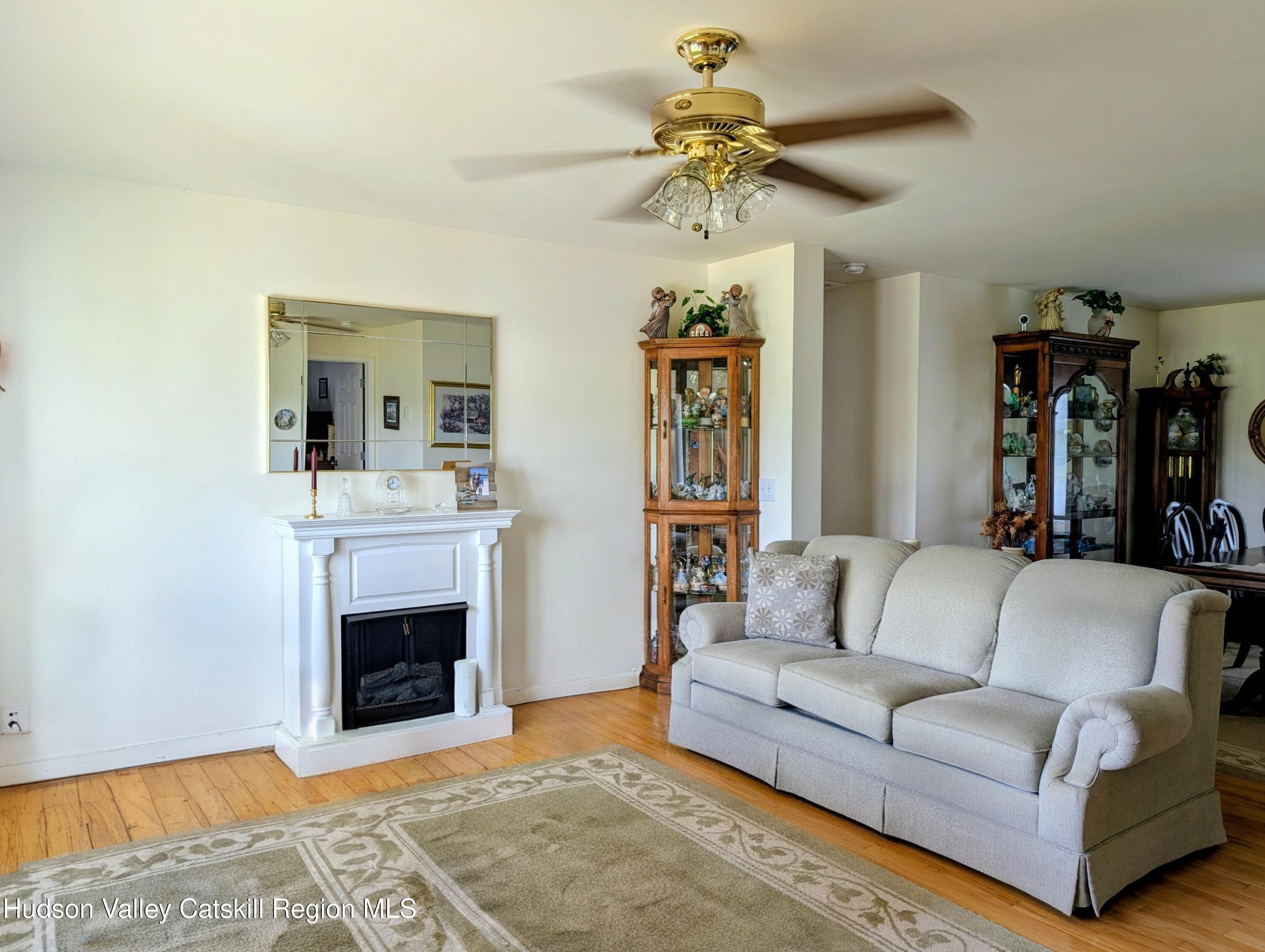 834 Co Rte 19 Elizaville, NY 12523 - Photo 6 of 32 a living room with furniture and a fireplace