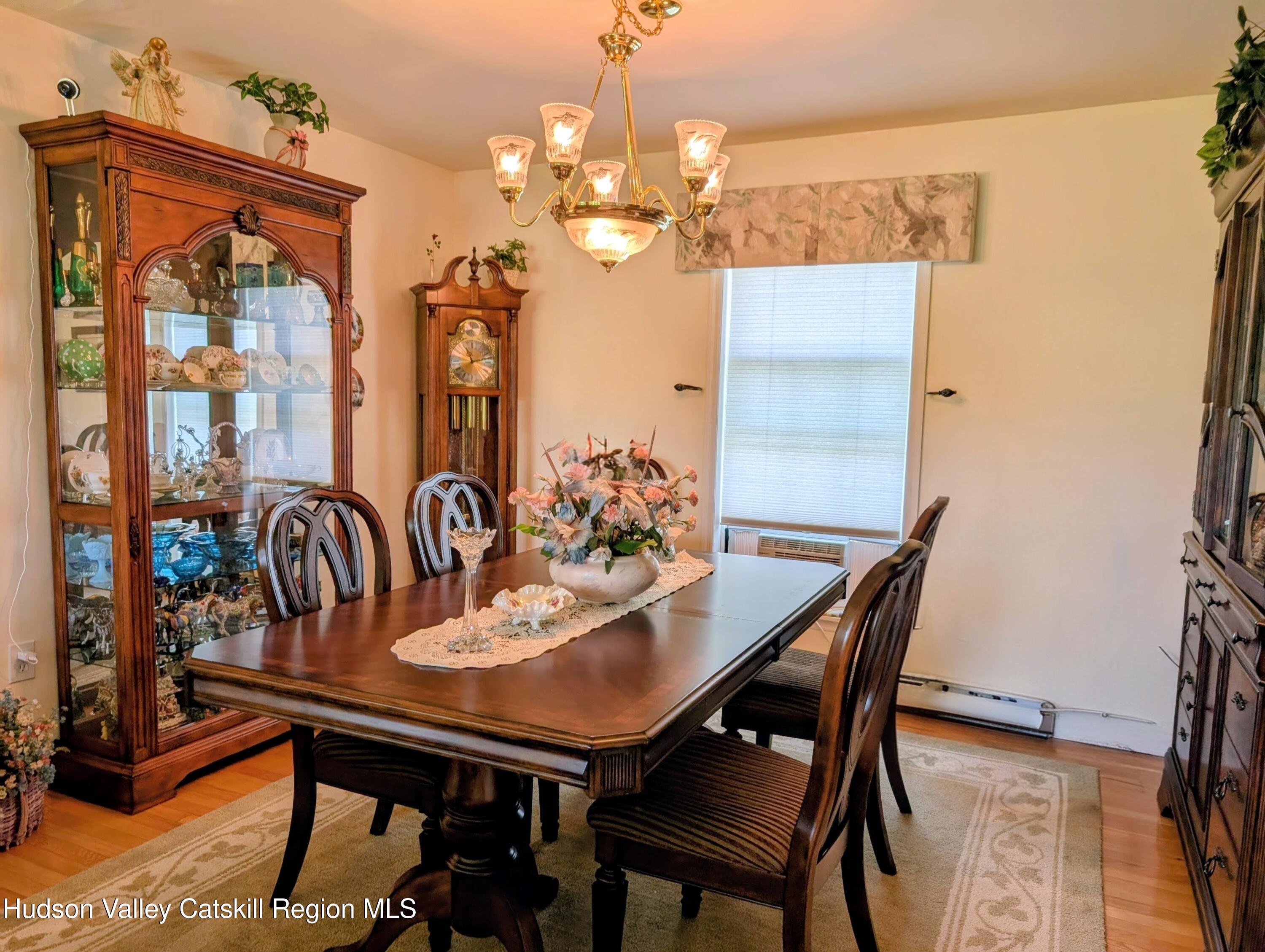 834 Co Rte 19 Elizaville, NY 12523 - Photo 7 of 32 a view of a dining room with furniture and chandelier