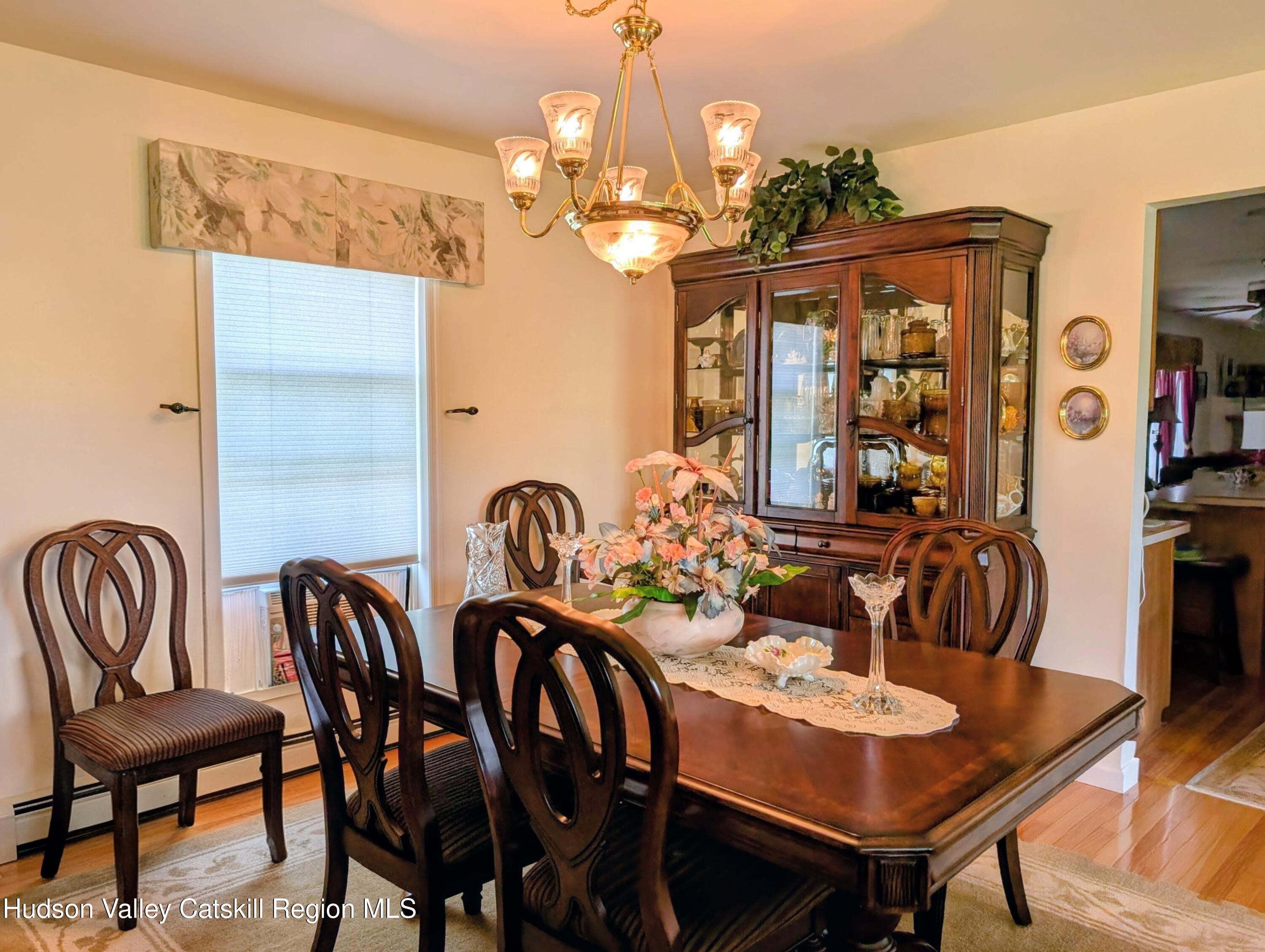 834 Co Rte 19 Elizaville, NY 12523 - Photo 8 of 32 a view of a dining room with furniture and chandelier