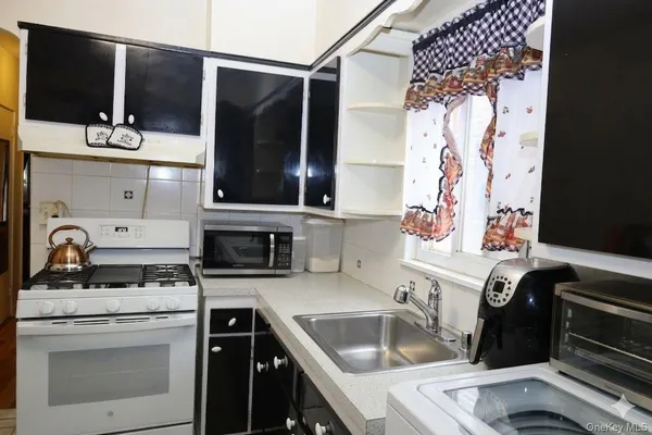 a kitchen with a stove and a sink